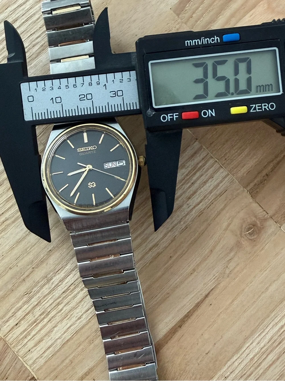 Seiko SQ Vintage Watch Gold Plated Bezel and Bracelet Black Dial Date Window